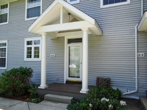 Grey exterior of condo building.